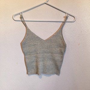 semi-spaghetti tank top in a tanish color.